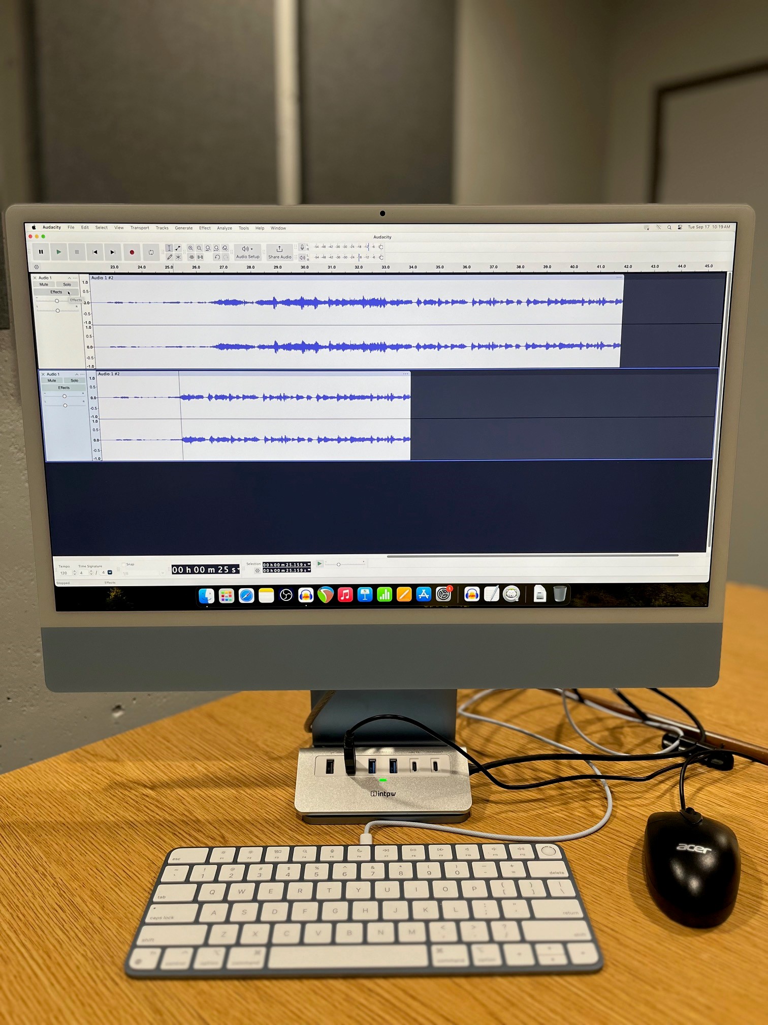 Image of Mac computer featuring audio editing software in Podcast and Content Creation room